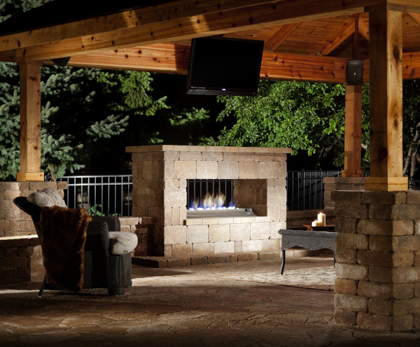 All Seasons Pools & Spas example of work showing an outdoor sitting area with roof, tv and fireplace.
